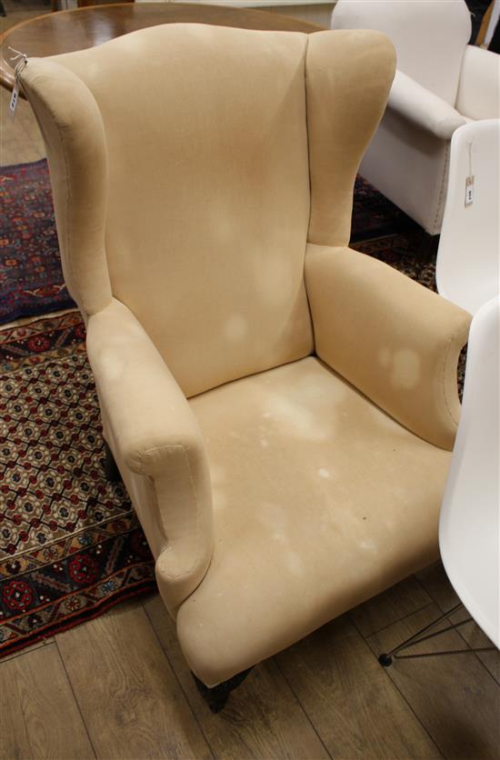 An early 20th century wing armchair